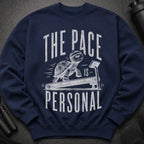 Navy sweatshirt with a turtle on a treadmill graphic and text "THE PACE IS PERSONAL."