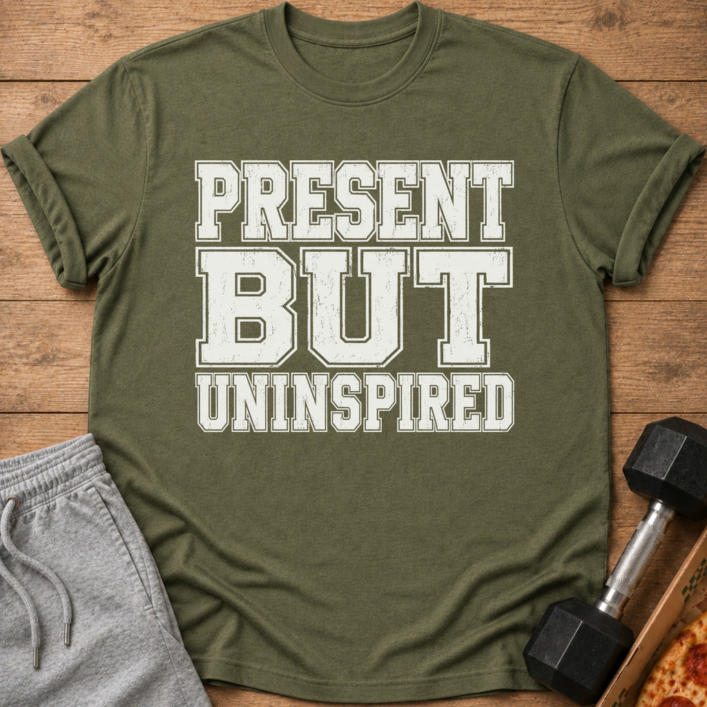 Olive green t-shirt with "PRESENT BUT UNINSPIRED" text and gym accessories.