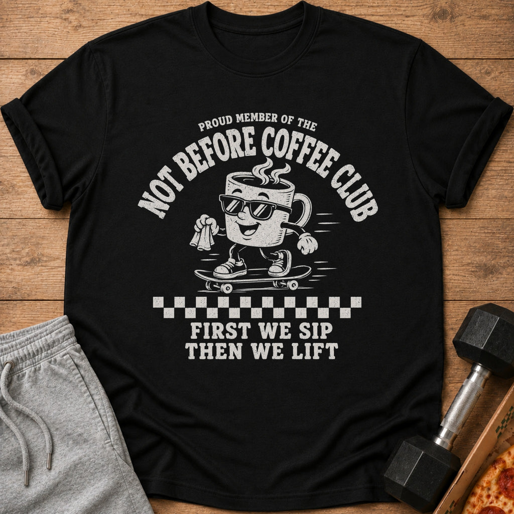 Black t-shirt with graphic: "Proud member of the Not Before Coffee Club. First we sip, then we lift."