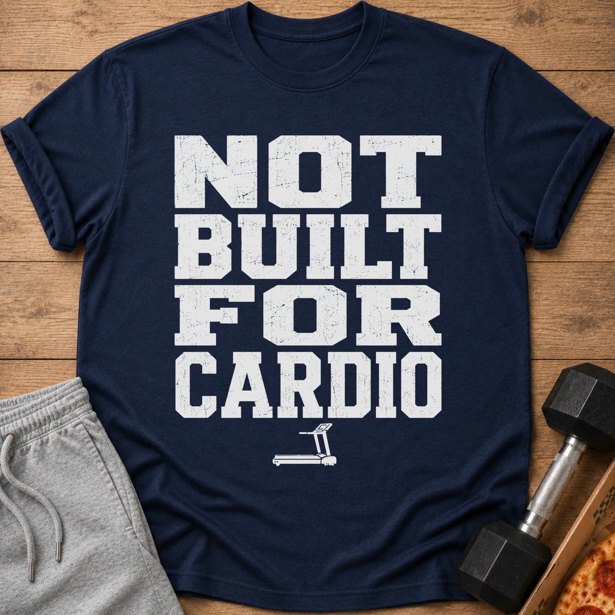 Navy t-shirt with white distressed text "NOT BUILT FOR CARDIO" and treadmill graphic.