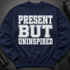 Navy sweatshirt with distressed white text reading "PRESENT BUT UNINSPIRED".