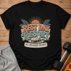 Black t-shirt with "Rest Day Resort All Inclusive Excuses" graphic and beach chair.