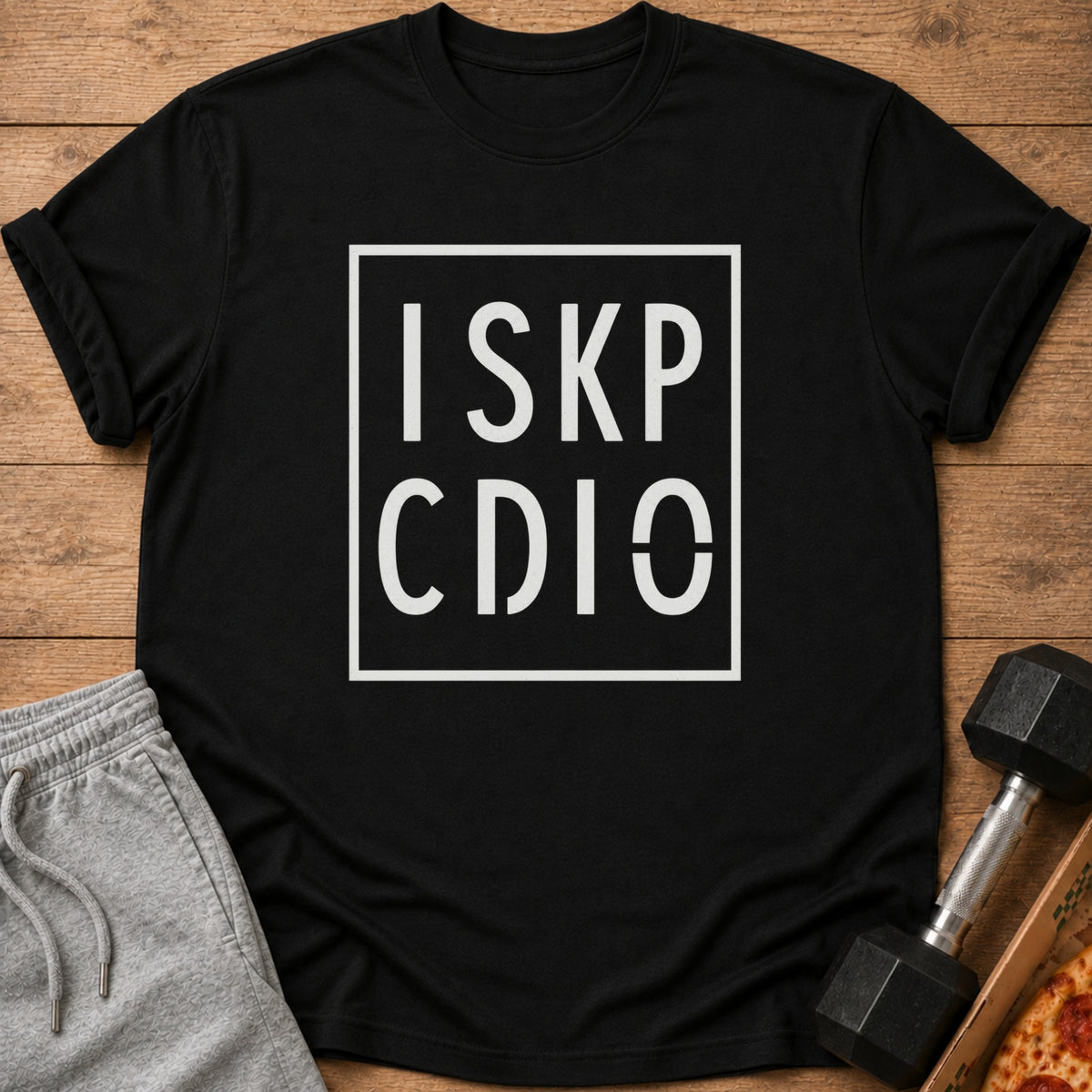 Black t-shirt with white text "I SKP CDIO" inside a white box.