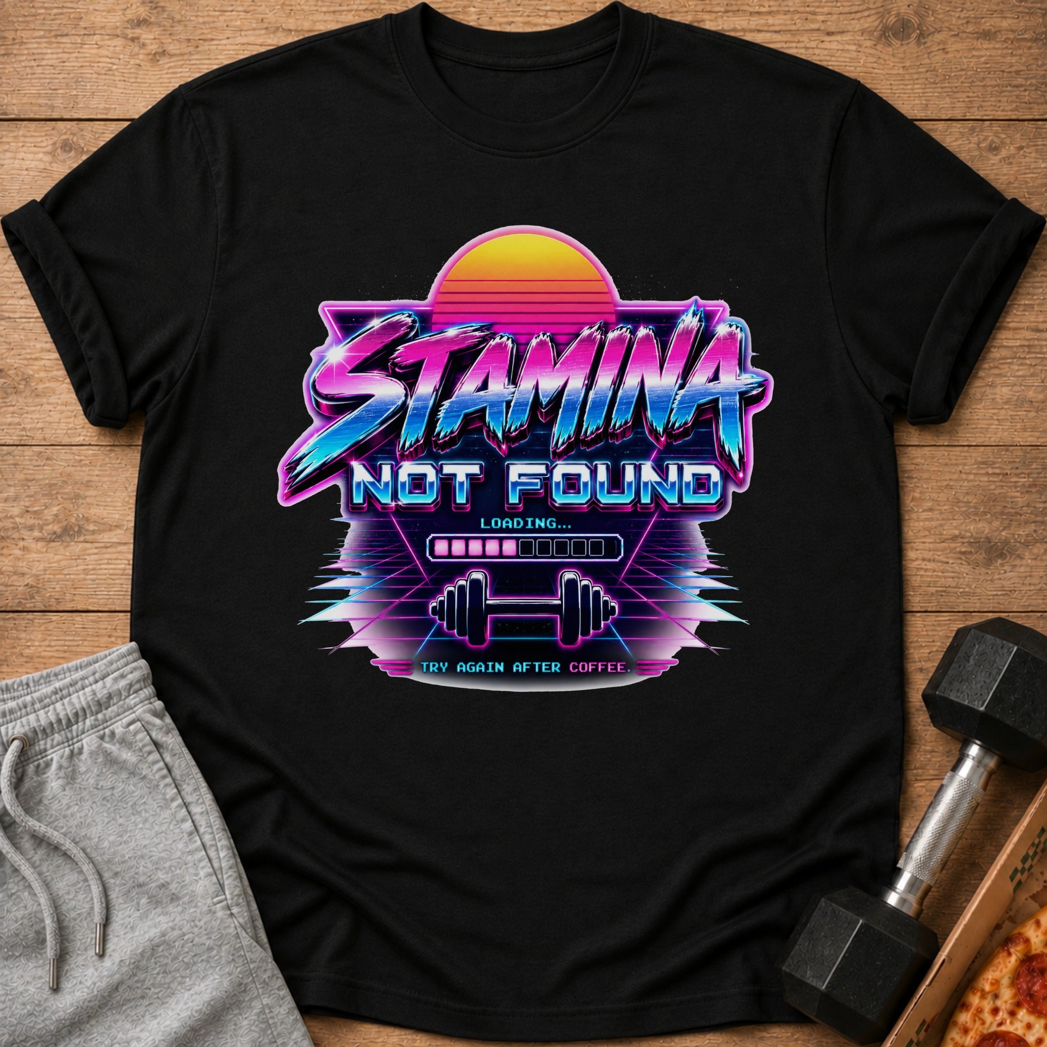 Black t-shirt graphic with retro text "STAMINA NOT FOUND LOADING..." and dumbbells.