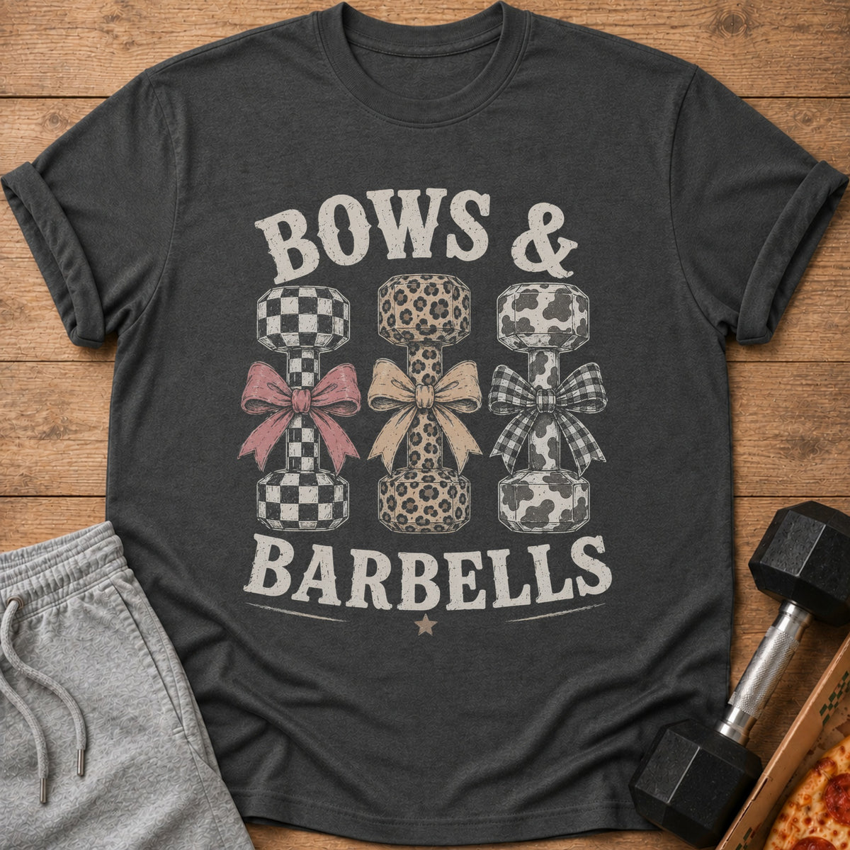 T-shirt with "Bows & Barbells" text and patterned dumbbells.