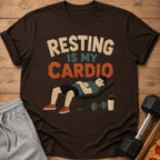 T-shirt with "Resting Is My Cardio" text, a sleeping man on a bench, and dumbbells.