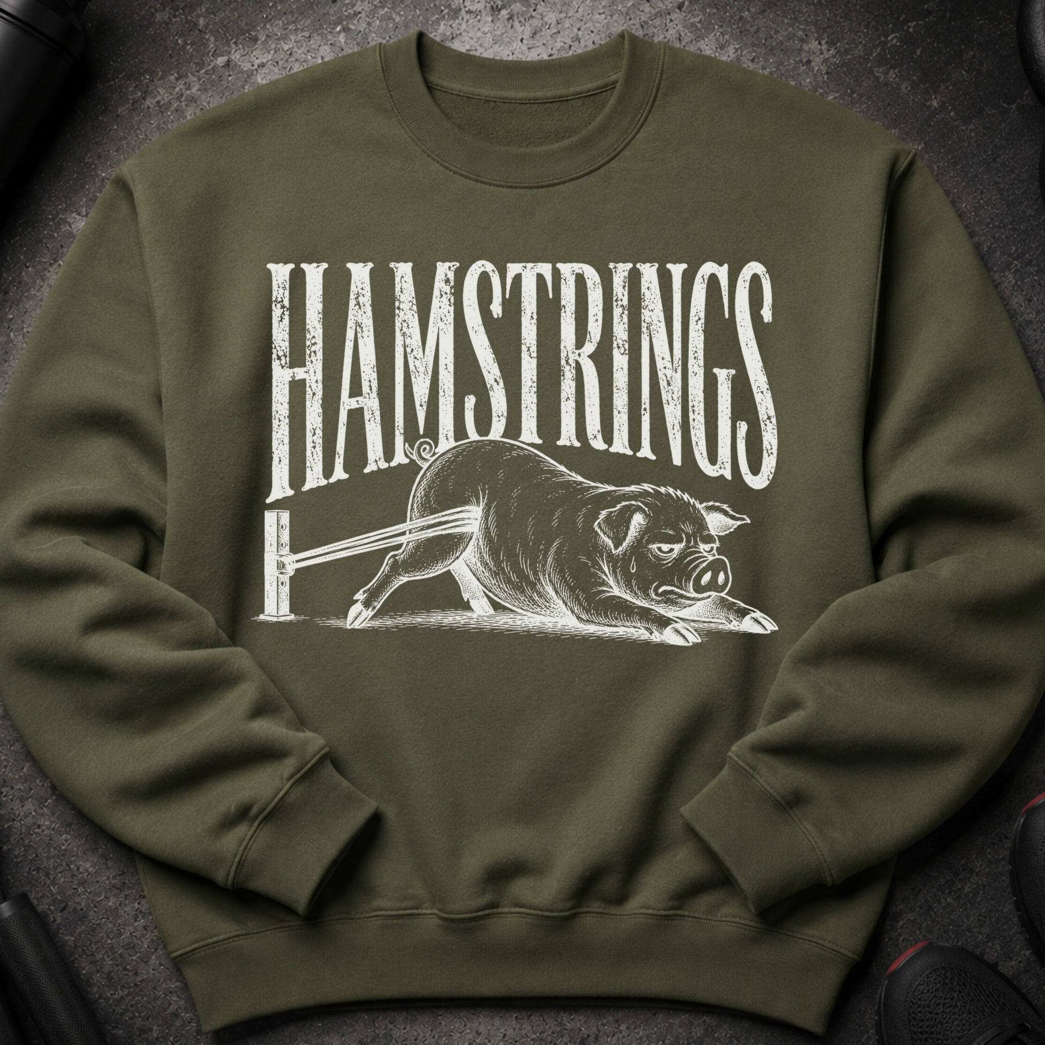 Olive green sweatshirt with white "HAMSTRINGS" text and a pig graphic.