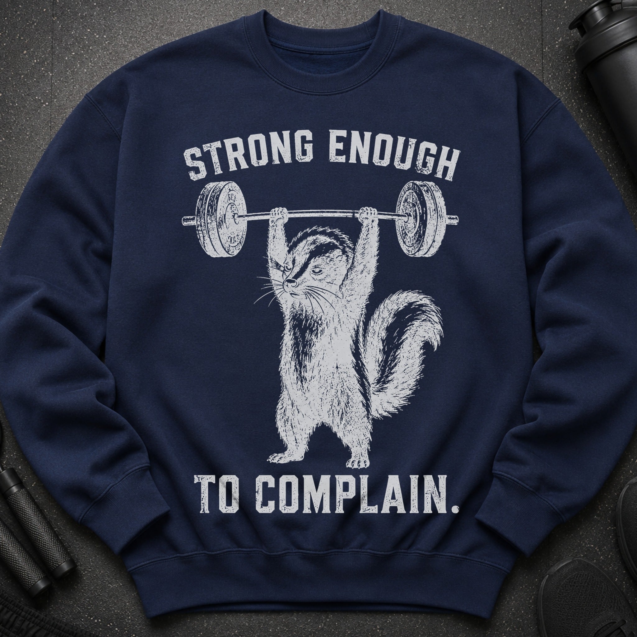 Navy sweatshirt with white graphic of a squirrel lifting weights and text "STRONG ENOUGH TO COMPLAIN."