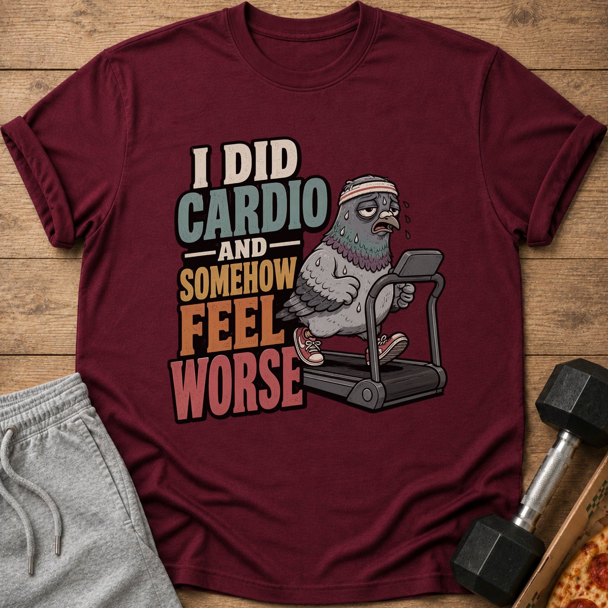 Maroon t-shirt with cartoon pigeon on treadmill, text "I DID CARDIO AND SOMEHOW FEEL WORSE".