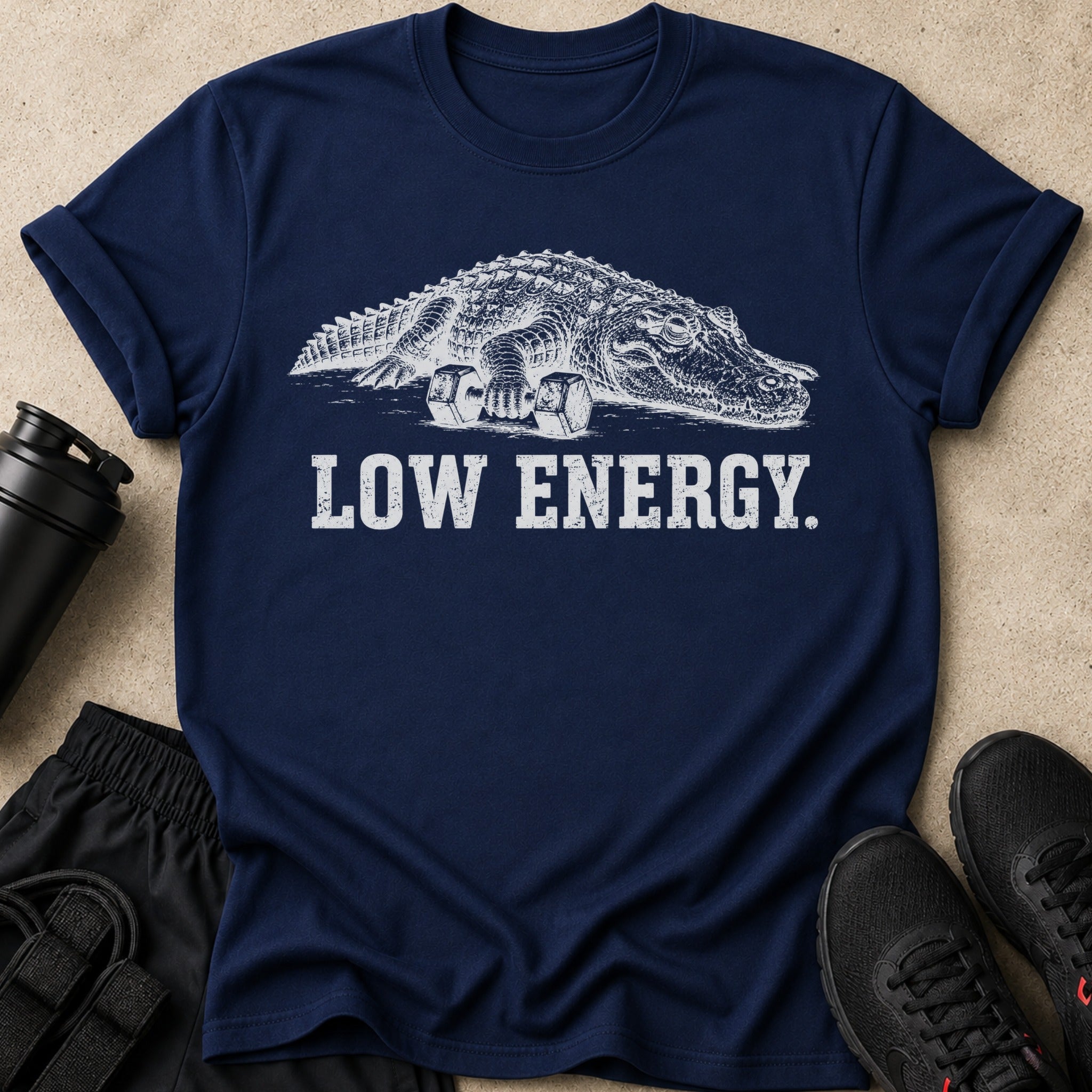 Navy t-shirt with graphic of alligator on dumbbells and text "LOW ENERGY."