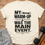 Cream t-shirt with black text "MY WARM-UP WAS THE MAIN EVENT."