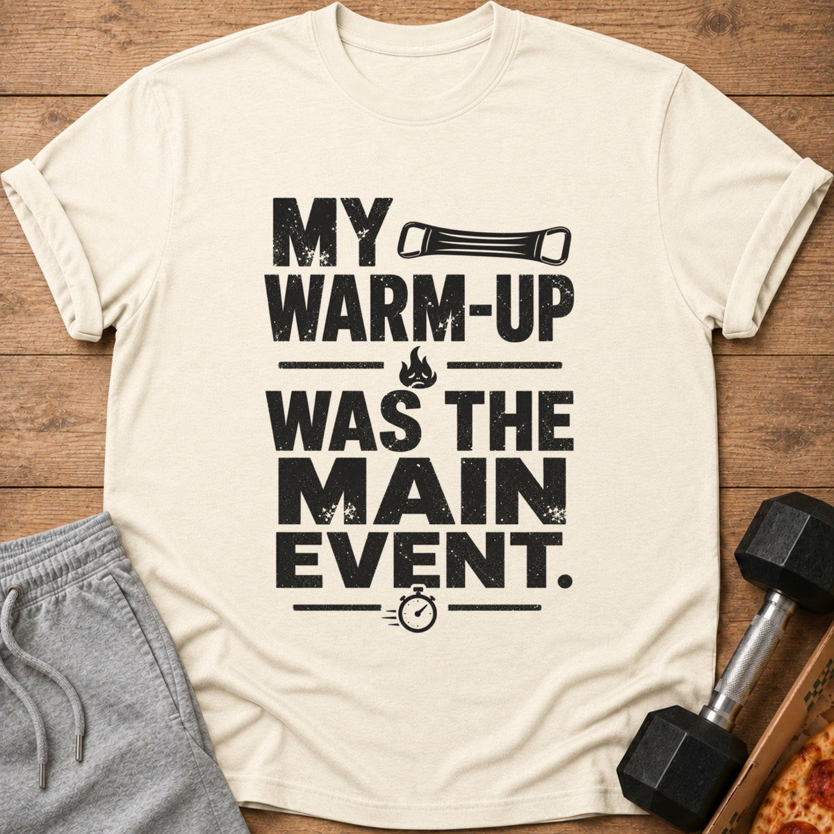 Cream t-shirt with black text "MY WARM-UP WAS THE MAIN EVENT."