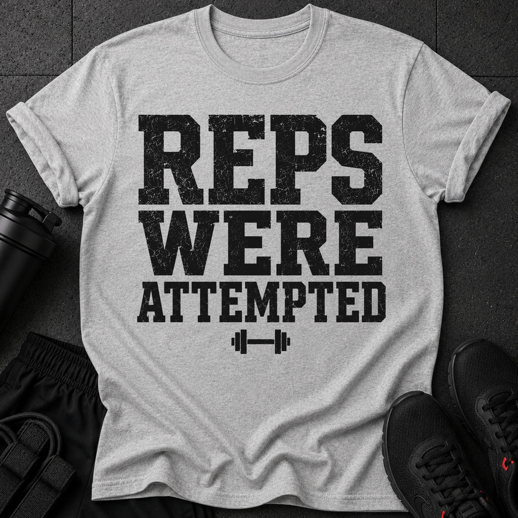Light grey t-shirt with black text "REPS WERE ATTEMPTED" and a dumbbell.