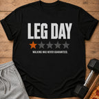 Black t-shirt with "LEG DAY" text, one orange and four gray stars, and "WALKING WAS NEVER GUARANTEED."