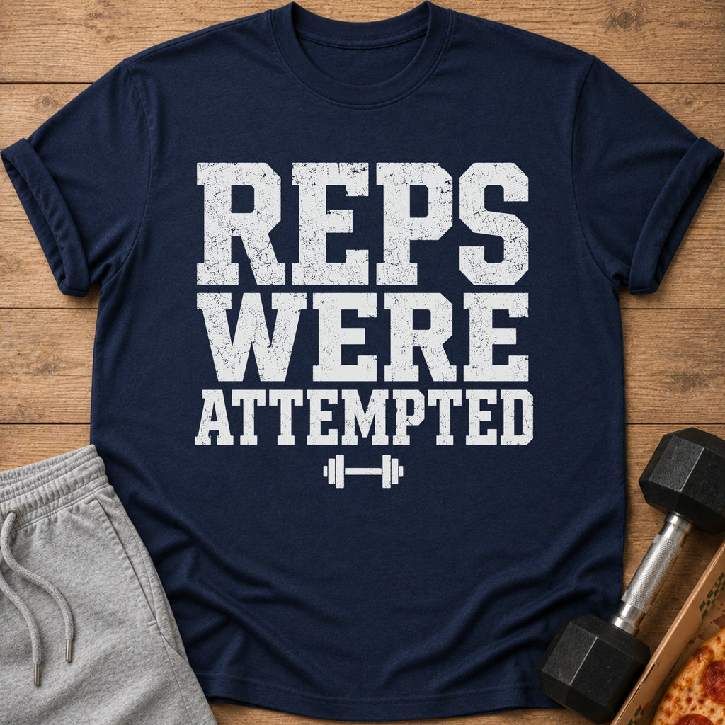 Navy t-shirt with white text "REPS WERE ATTEMPTED" and a dumbbell graphic.