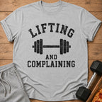Grey t-shirt with "LIFTING AND COMPLAINING" and barbell graphic.