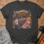 Dark gray t-shirt featuring a colorful graphic with text reading Pumpkin Spice and Personal Bests, surrounded by pumpkins, autumn leaves, a coffee cup, a dumbbell, and a sneaker.
