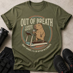 Olive green t-shirt with a capybara on a treadmill drinking from a cup.