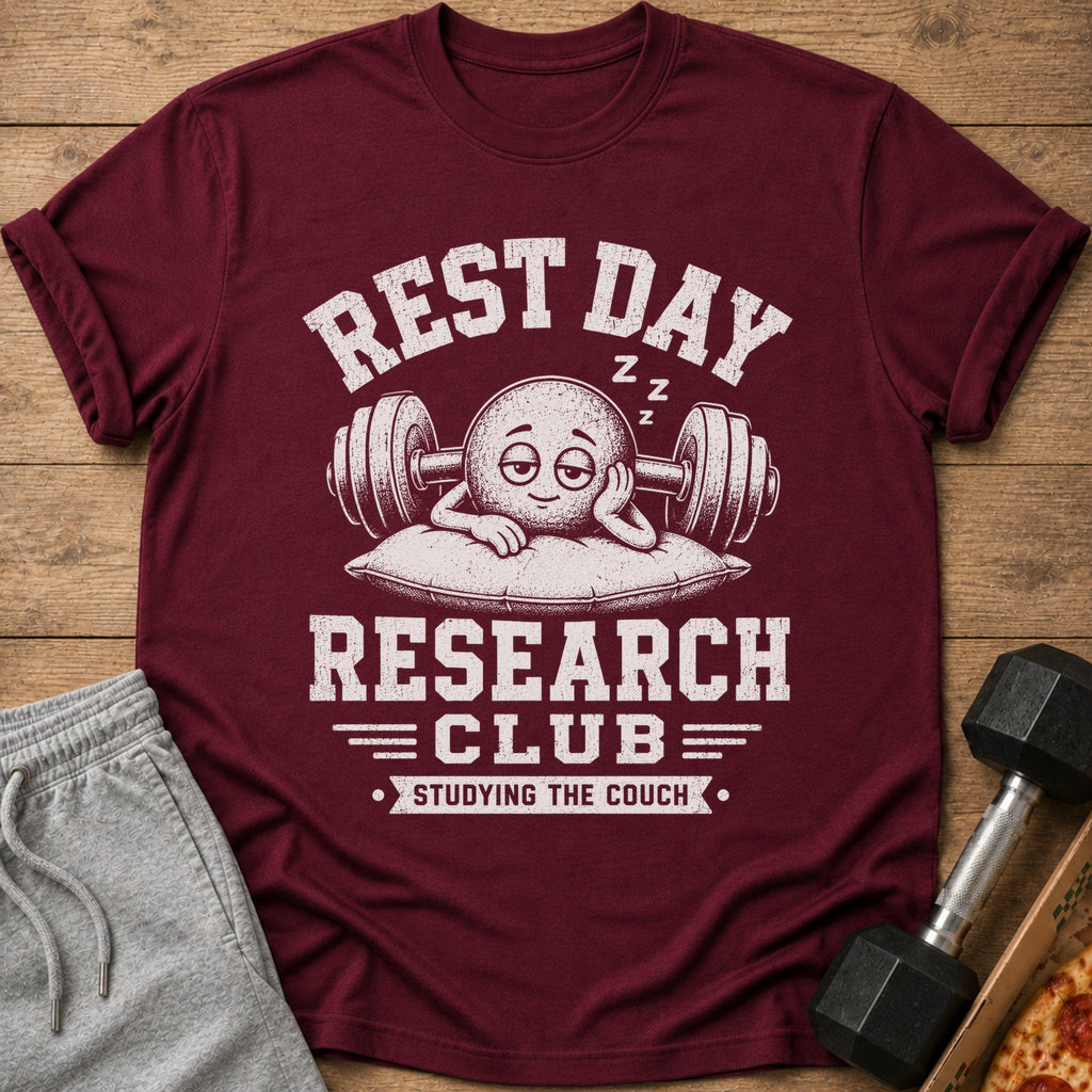 Maroon t-shirt with graphic reading "Rest Day Research Club Studying the Couch."