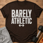 Brown t-shirt with "BARELY ATHLETIC" text and a dumbbell graphic.
