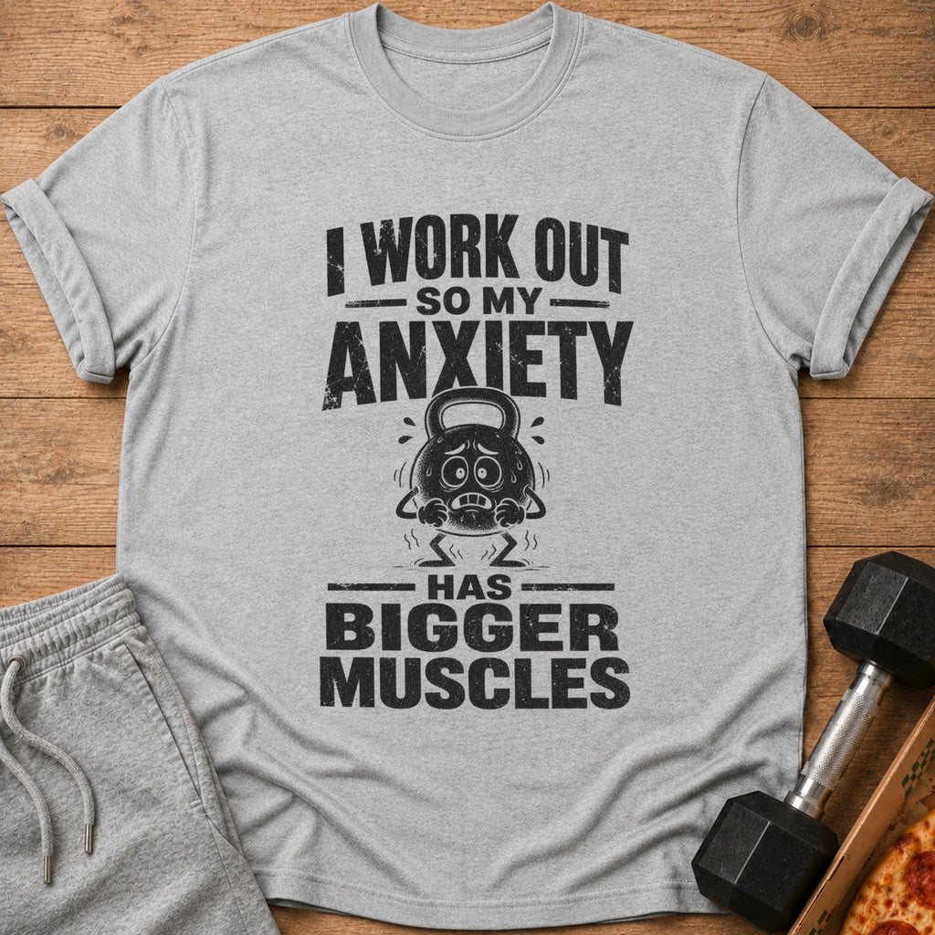 Grey t-shirt with distressed text "I work out so my anxiety has bigger muscles" and a cartoon kettlebell.