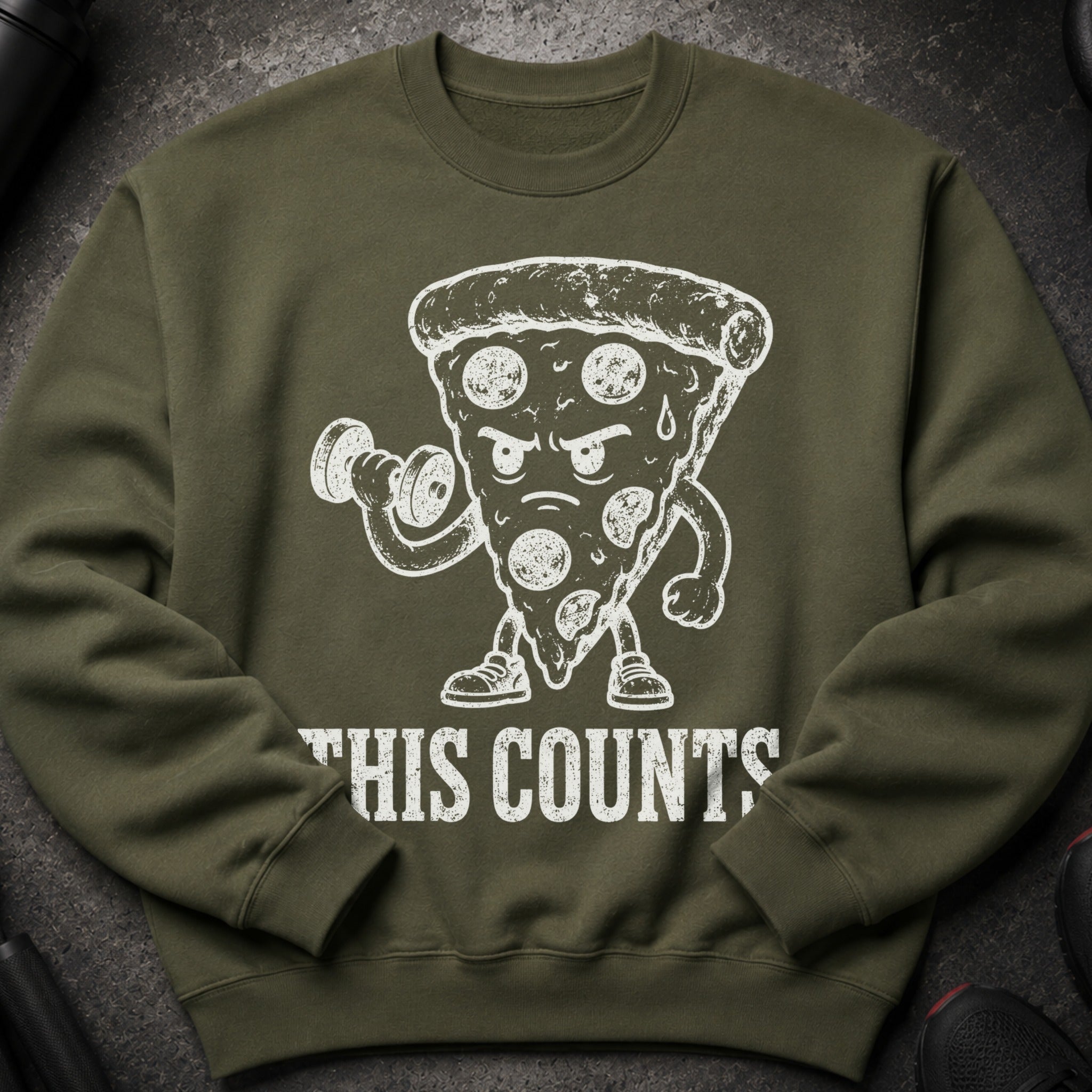 Green sweatshirt with a cartoon pizza slice lifting weights and the text "THIS COUNTS".