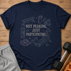 Navy t-shirt with gym icons and text "Not Peaking. Just Participating."