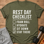 Green t-shirt with white text: "REST DAY CHECKLIST FOAM ROLL HYDRATE SIT DOWN STAY THERE."