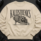 Light beige sweatshirt with black graphic text "KALEISTHENICS" and a kale character doing a plank.