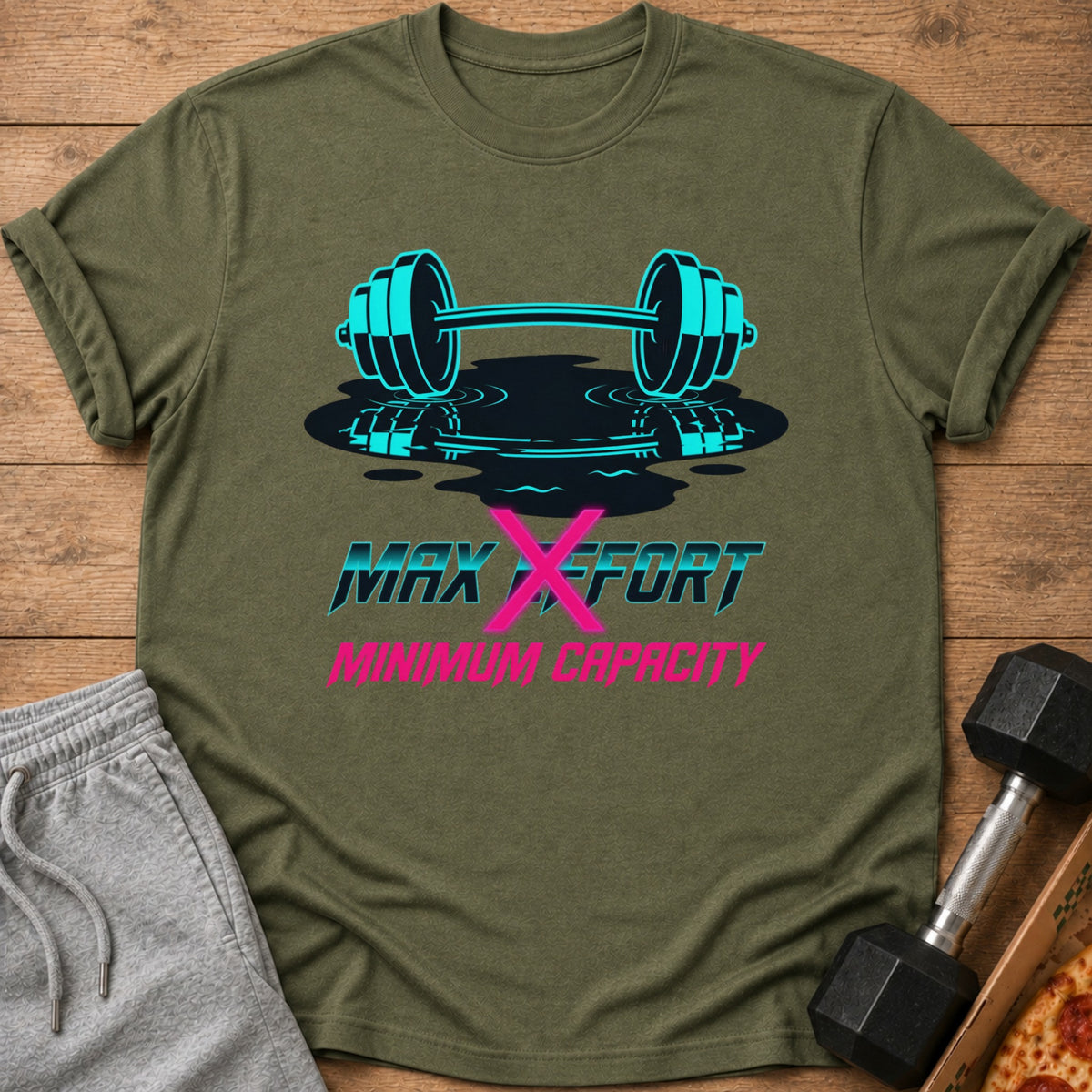 Olive green t-shirt with barbell graphic and text "MAX EFFORT MINIMUM CAPACITY".