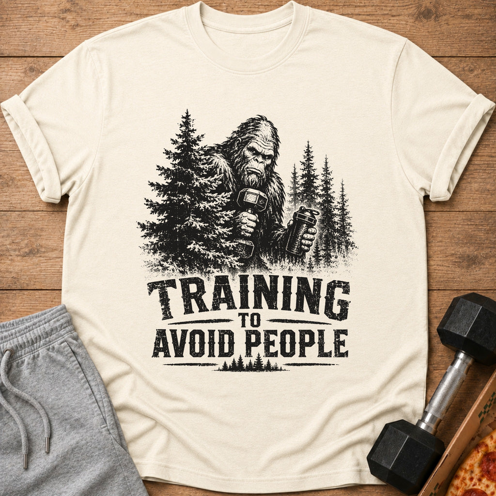 Bigfoot lifting weights in trees with text "Training to Avoid People".