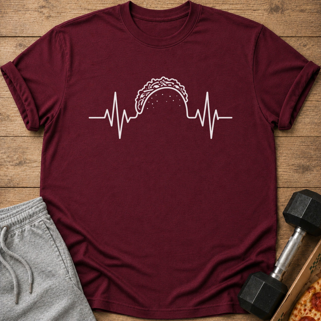 Maroon t-shirt with white taco heartbeat graphic, gray sweatpants, dumbbell, and pizza.