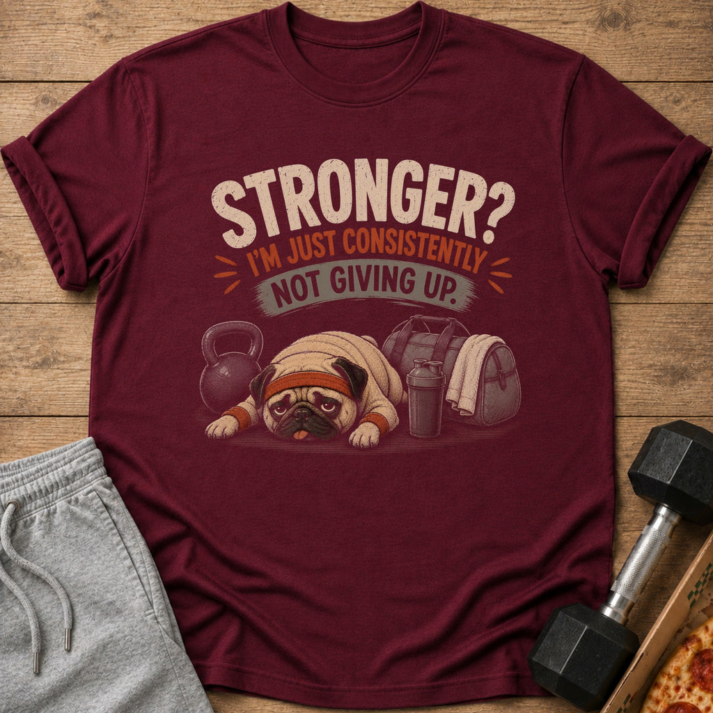 Maroon t-shirt with pug, gym bag, dumbbell, and text: "STRONGER? I'M JUST CONSISTENTLY NOT GIVING UP."
