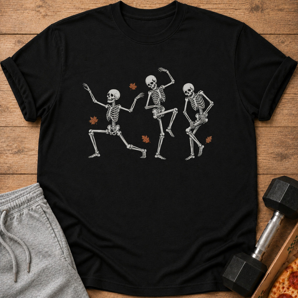 Black t-shirt with three dancing skeletons and falling autumn leaves graphic.