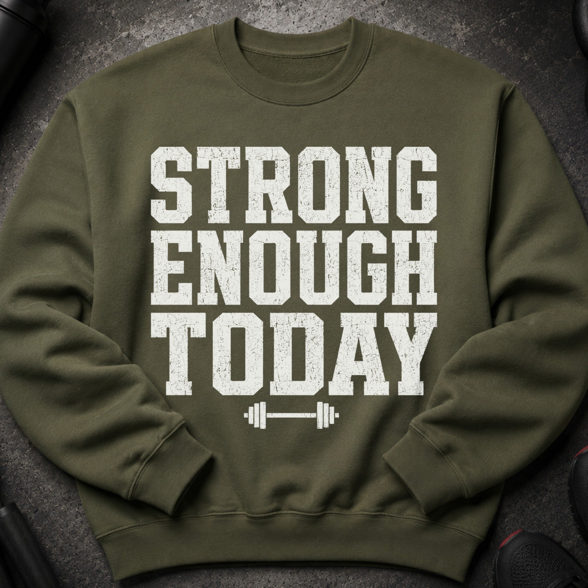 Olive green sweatshirt with white text "STRONG ENOUGH TODAY" and a barbell graphic.