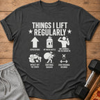 Dark grey t-shirt with "Things I Lift Regularly" text and humorous gym illustrations.