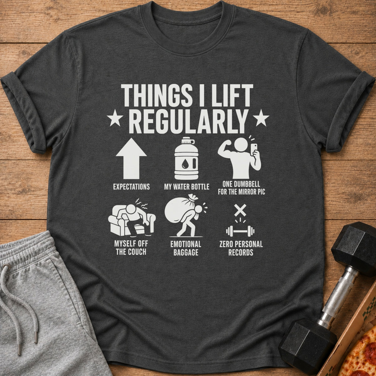 Dark grey t-shirt with "Things I Lift Regularly" text and humorous gym illustrations.
