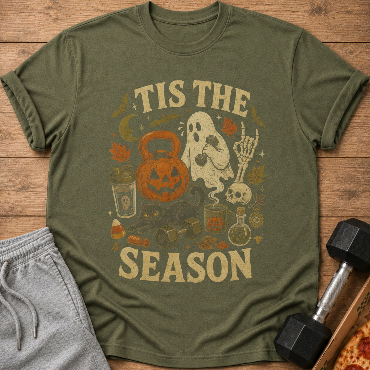 Green t-shirt with "Tis The Season" and Halloween workout graphics.