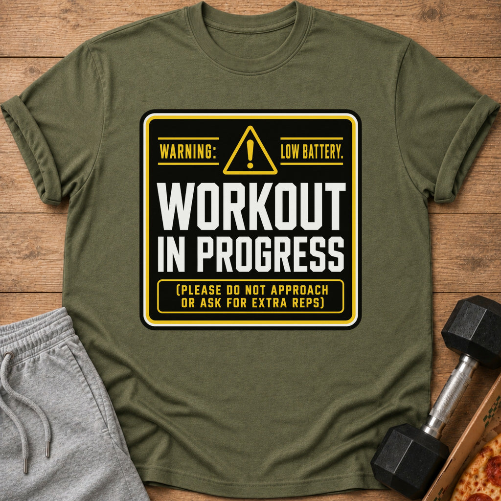 Olive green t-shirt with "Warning: Low Battery. Workout in Progress. (Please do not approach or ask for extra reps)" text.
