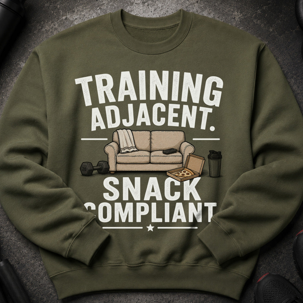 Olive green sweatshirt with "TRAINING ADJACENT. SNACK COMPLIANT" text and graphics.