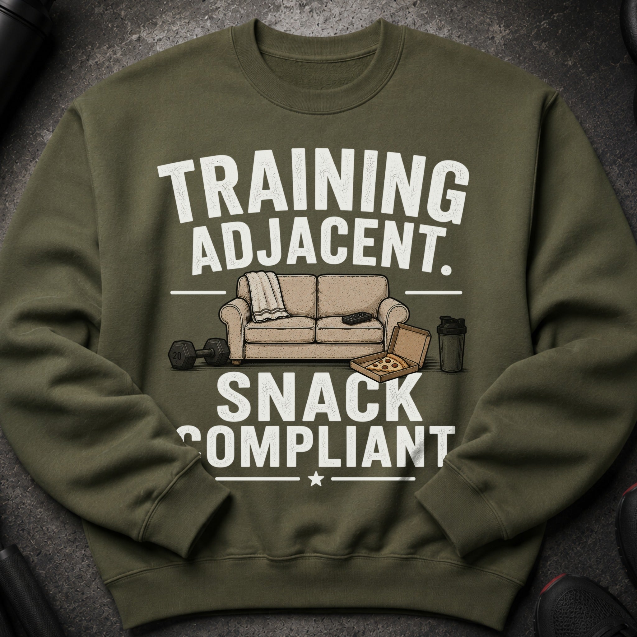 Olive green sweatshirt with "TRAINING ADJACENT. SNACK COMPLIANT" text and graphics.