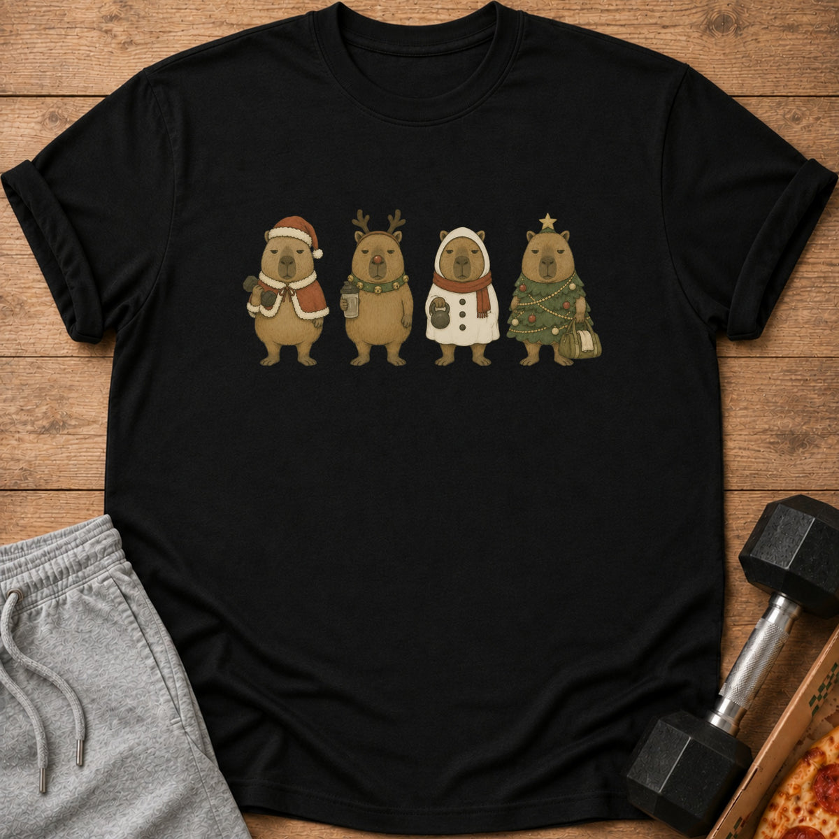 Black t-shirt with four capybaras in festive holiday outfits.