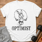 T-shirt with black and white drawing of a rabbit jumping rope with "OPTIMIST" text.