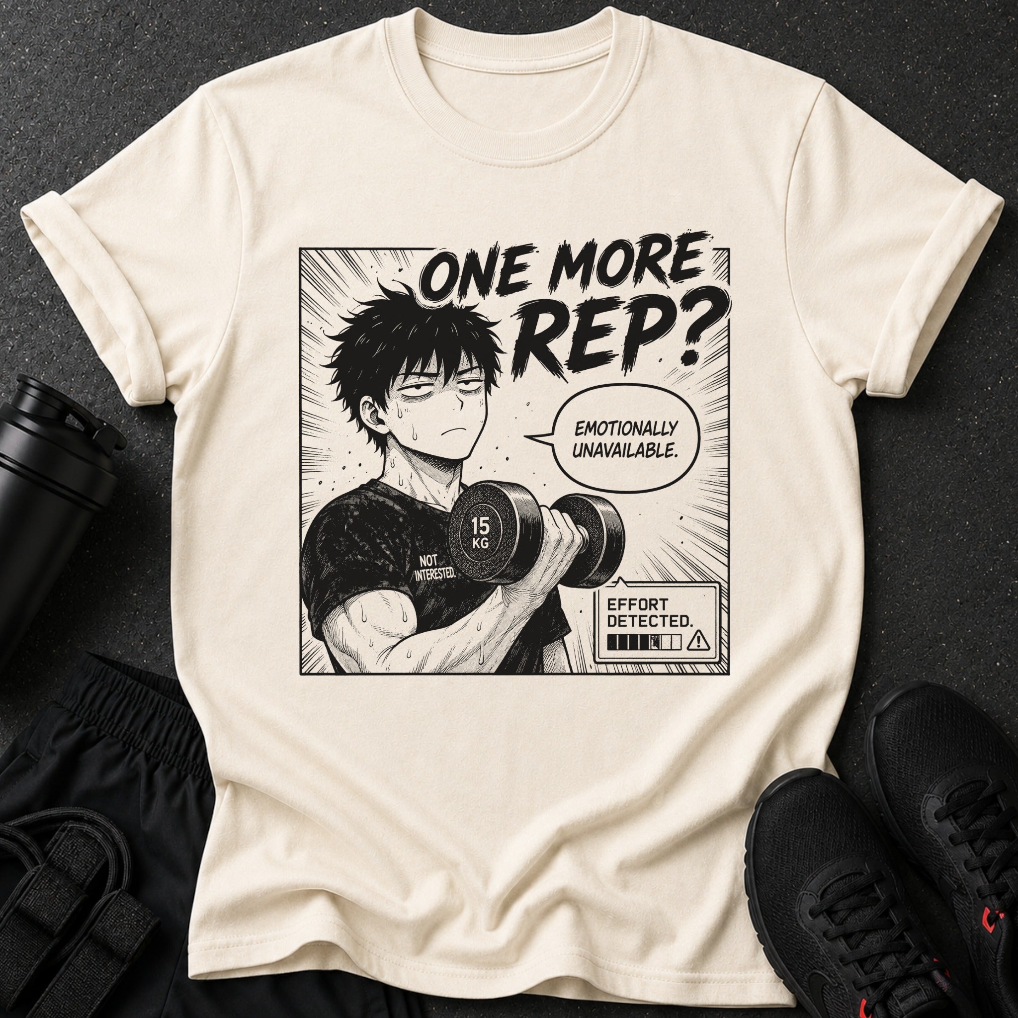 Cream t-shirt with anime graphic: "One More Rep?" and man holding 15kg dumbbell.