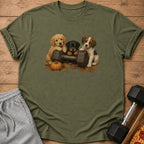 Three puppies sit on a dumbbell with autumn leaves and a pumpkin.
