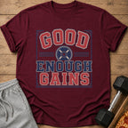 Burgundy t-shirt with "GOOD ENOUGH GAINS" text and weight plate graphic.
