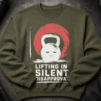 Green sweatshirt with a distressed kettlebell graphic and the text "Lifting in Silent Disapproval".