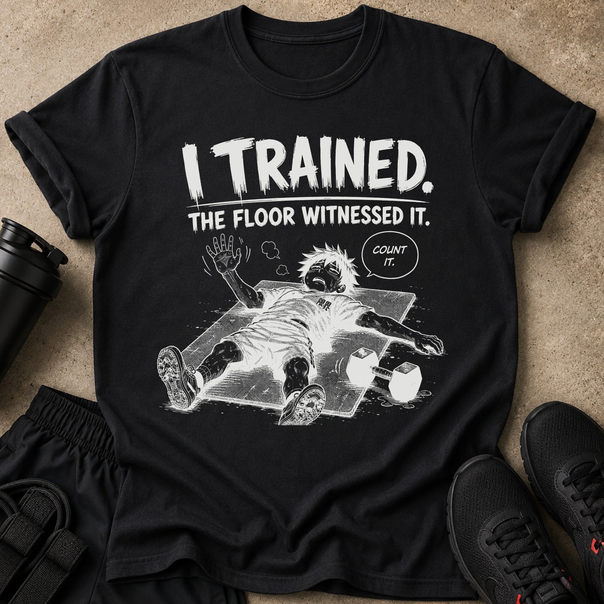 Black t-shirt with graphic text "I TRAINED. THE FLOOR WITNESSED IT. COUNT IT."
