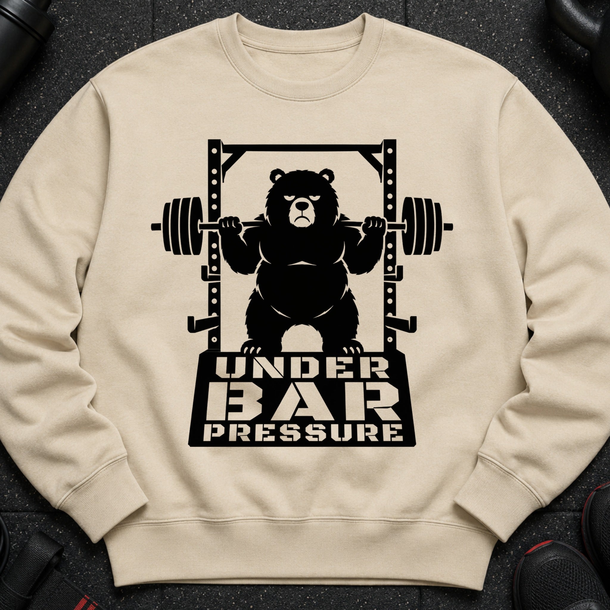 Black bear lifting barbell under gym rack with text "UNDER BAR PRESSURE"