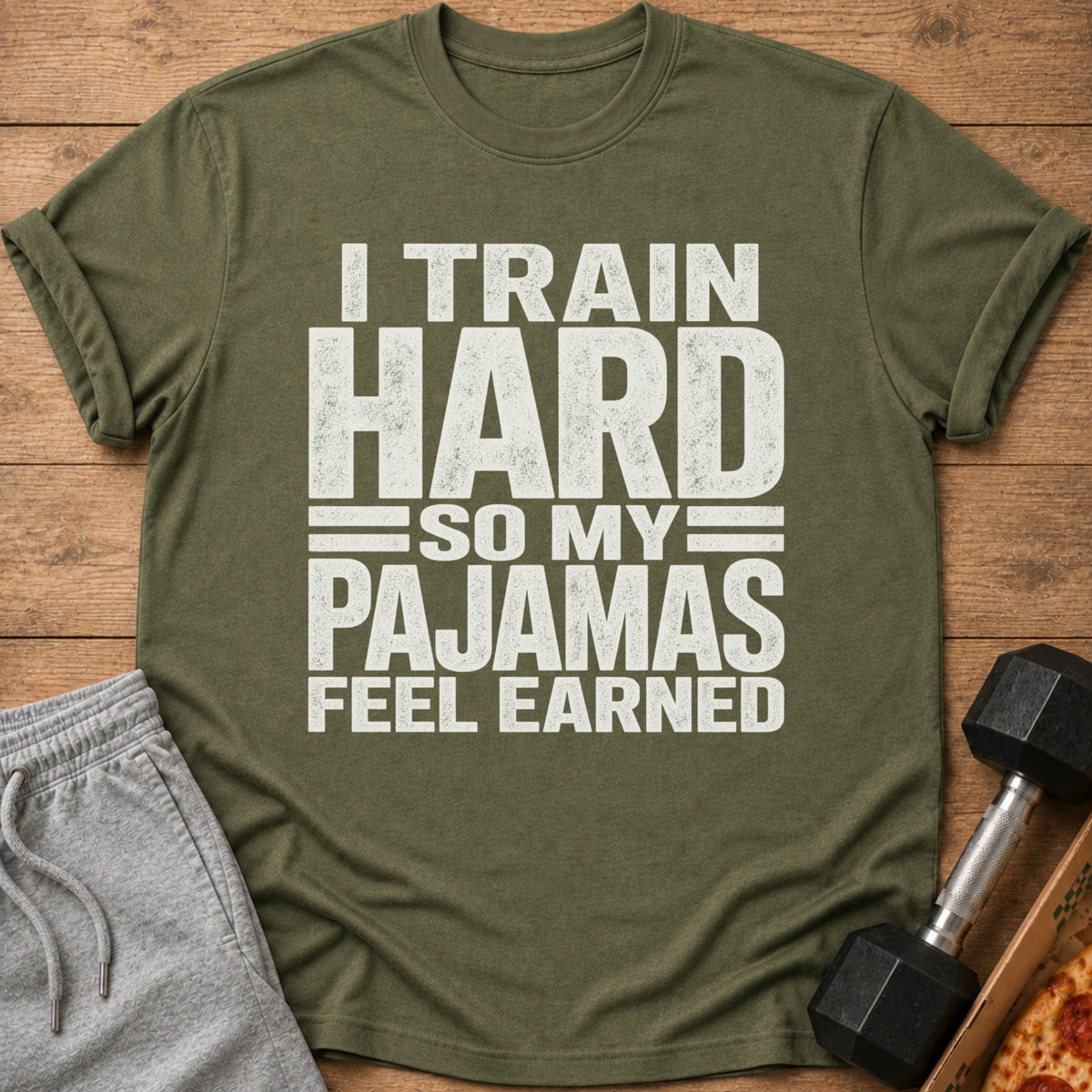 Olive green t-shirt with text "I TRAIN HARD SO MY PAJAMAS FEEL EARNED".